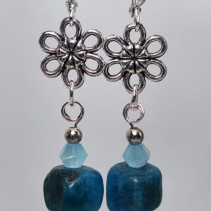 Square beads of apatite dangling from a metal daisy